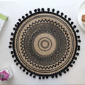 Beautiful round woven table mat with lace detail and pom-pom edges